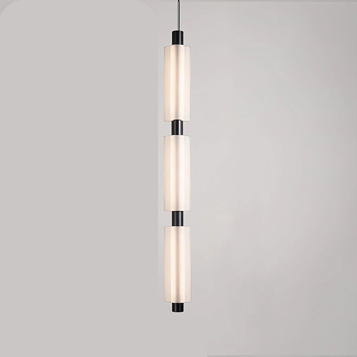 Linea modern long acrylic pendant light as bedside lighting.