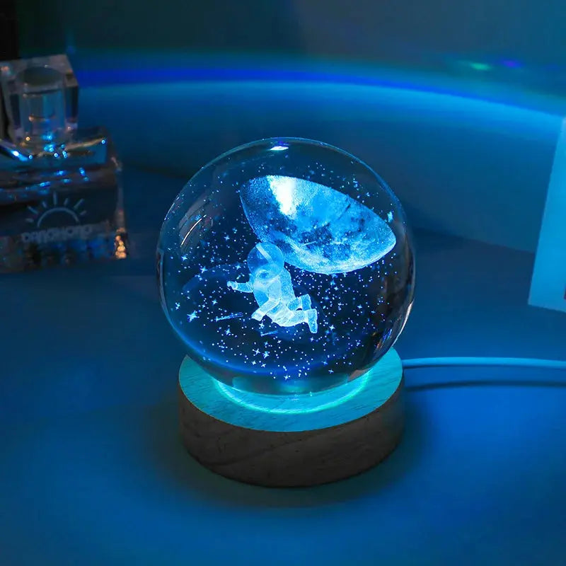 Cosmos 3D galaxy crystal sphere night light on wood base.