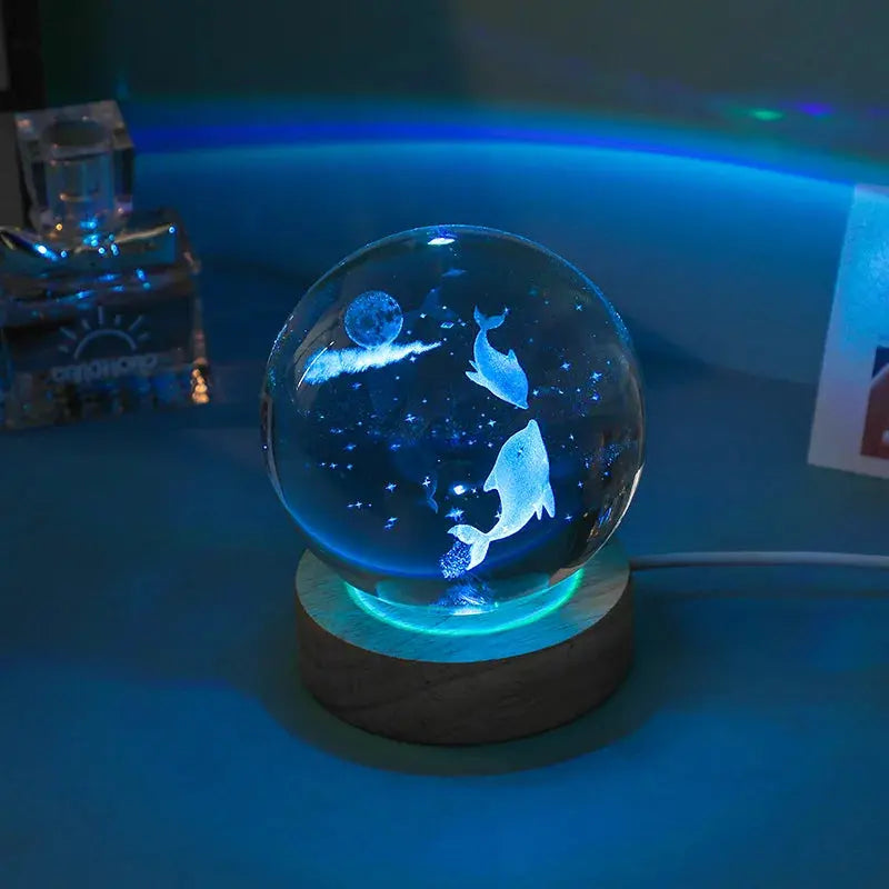 Cosmos 3D galaxy crystal sphere night light on wood base.
