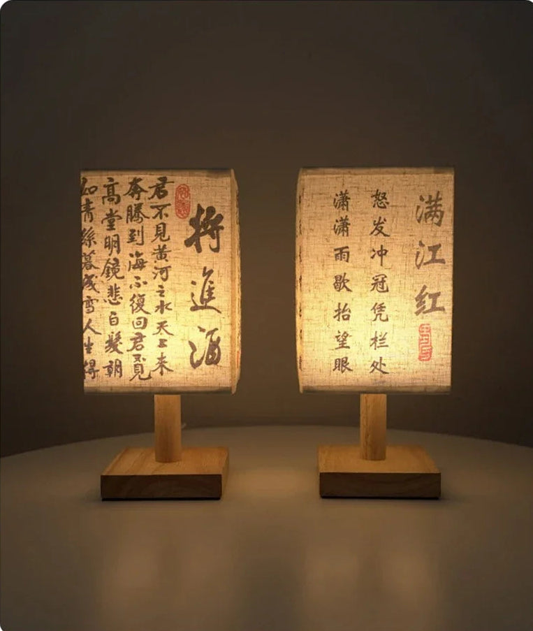 Close-up of the SereneScape Artisan Table Lamp's solid wood base and oriental art linen shade, showcasing its handcrafted quality. VelunaLumin.