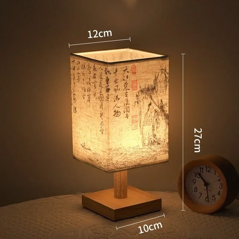 SereneScape Artisan Table Lamp with 'Sakura Bloom' oriental art linen shade, dimmable warm light, and solid wood base. VelunaLumin.
