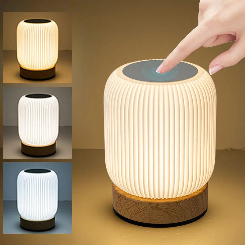 Close-up of a hand touching the AuraShroom lamp to adjust its brightness, showcasing the intuitive touch control. VelunaLumin.