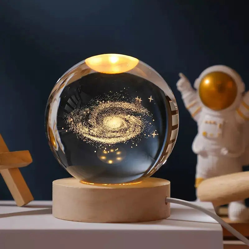 Cosmos 3D galaxy crystal sphere night light on wood base.