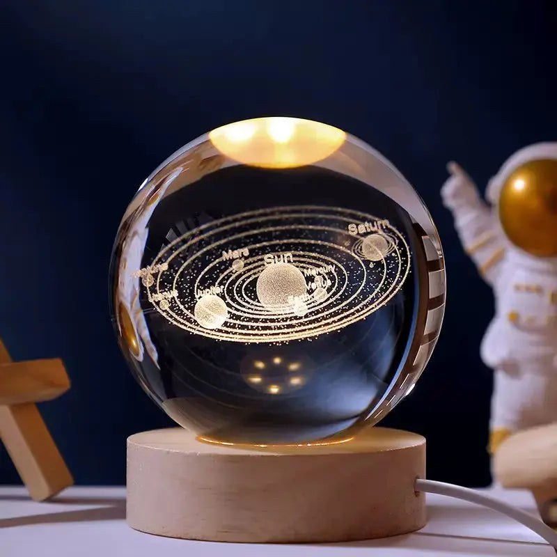 Cosmos 3D galaxy crystal sphere night light on wood base.