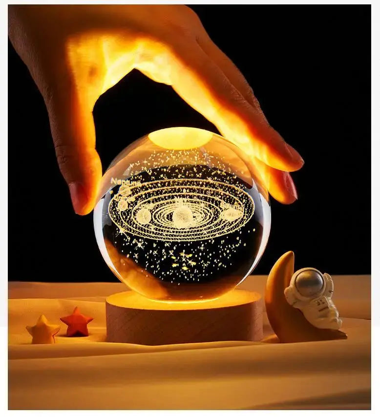 Cosmos 3D galaxy crystal sphere night light on wood base.