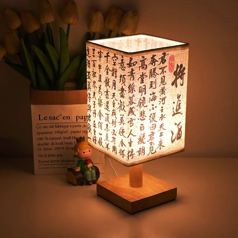 SereneScape Artisan Table Lamp with 'Celestial Cranes' oriental art linen shade, dimmable warm light, and solid wood base. VelunaLumin