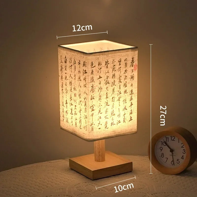 SereneScape Artisan Table Lamp with 'Mountain Pagoda' oriental art linen shade, dimmable warm light, and solid wood base. VelunaLumin.