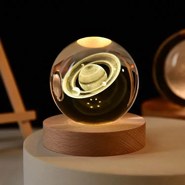 Cosmos 3D galaxy crystal sphere night light on wood base.