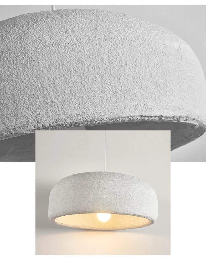 Close-up of ZenGlow Organic Pendant Light's white high-polymer shade, showcasing its fluid, paper-like texture and delicate sculptural form, VelunaLumin unique design.