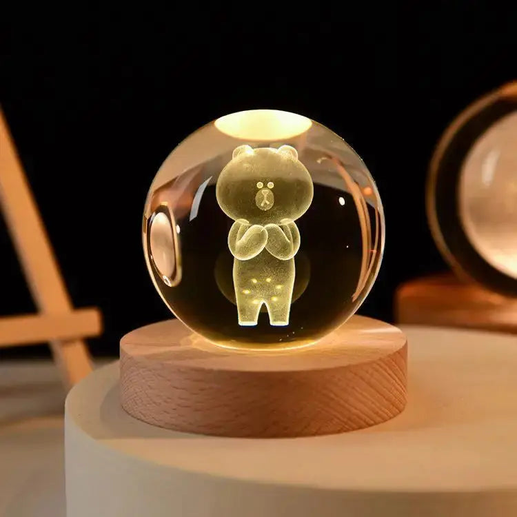 Cosmos 3D galaxy crystal sphere night light on wood base.