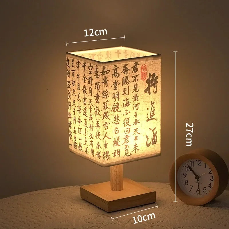 SereneScape Artisan Table Lamp with 'Celestial Cranes' oriental art linen shade, dimmable warm light, and solid wood base. VelunaLumin.