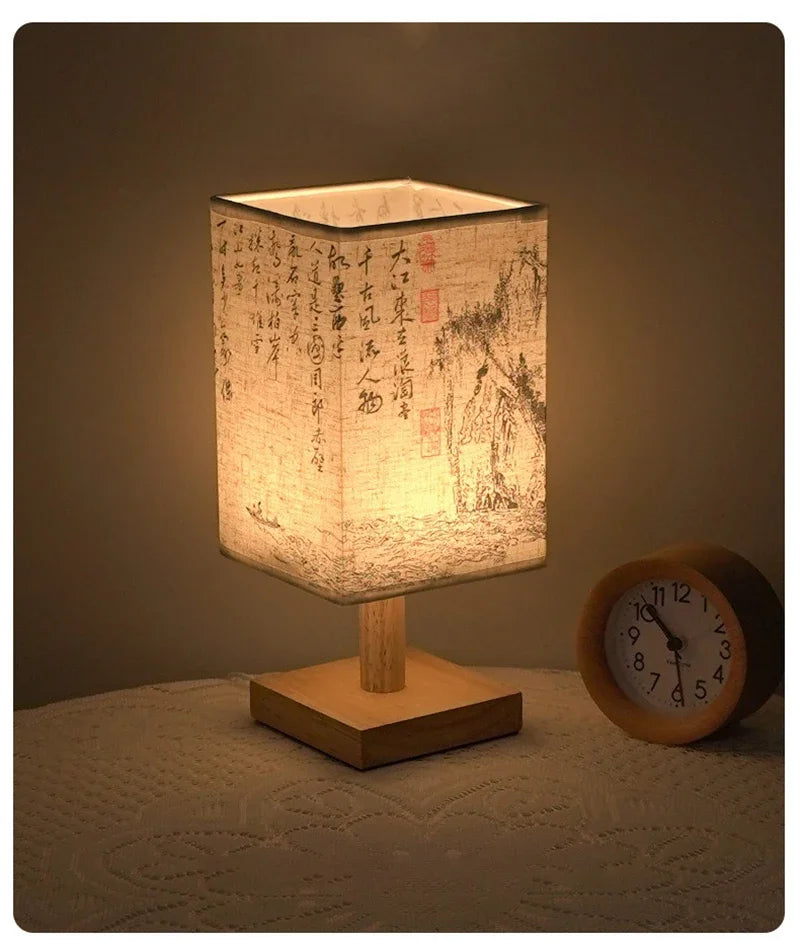 Close-up of the SereneScape Artisan Table Lamp's solid wood base and oriental art linen shade, showcasing its handcrafted quality. VelunaLumin.