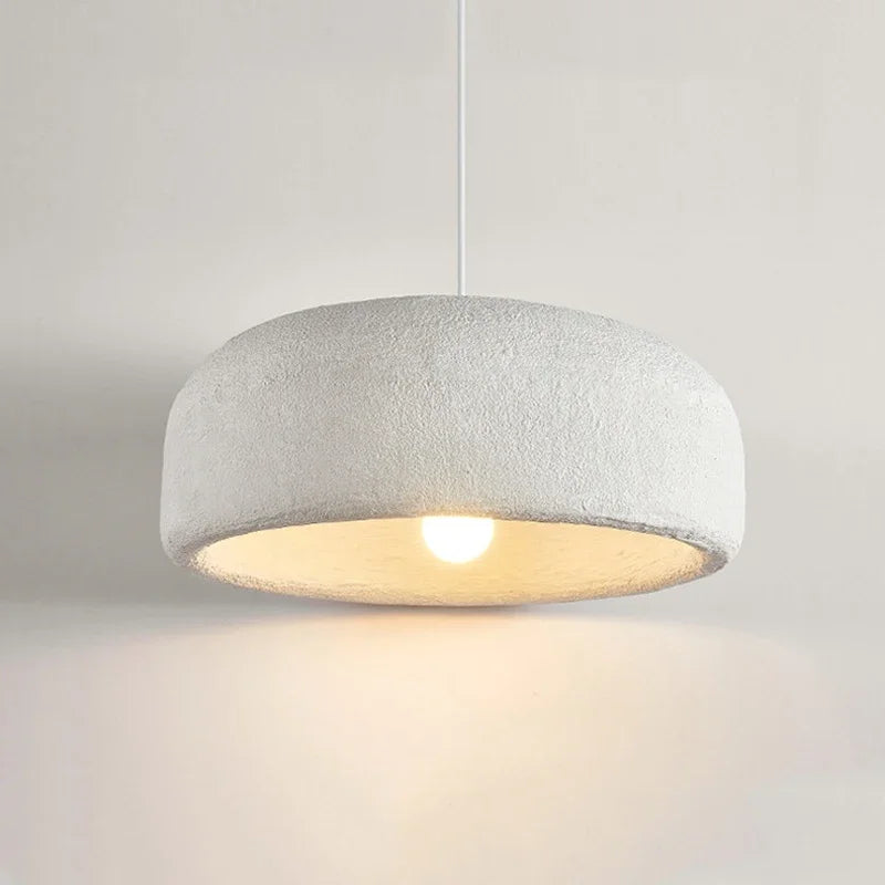 Close-up of ZenGlow Organic Pendant Light's white high-polymer shade, showcasing its fluid, paper-like texture and delicate sculptural form, VelunaLumin unique design.