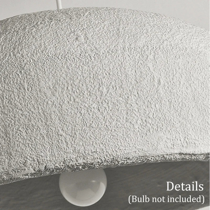 Close-up of ZenGlow Organic Pendant Light's white high-polymer shade, showcasing its fluid, paper-like texture and delicate sculptural form, VelunaLumin unique design.