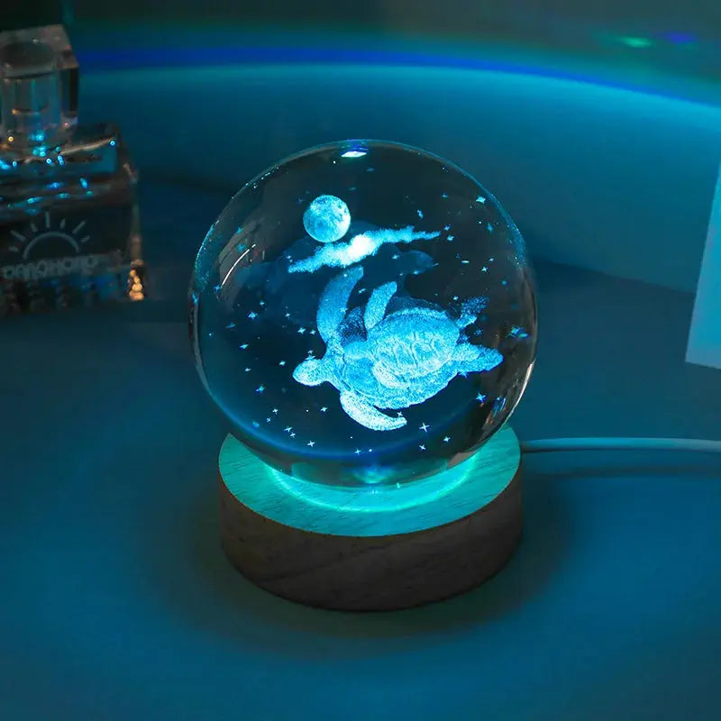 Cosmos 3D galaxy crystal sphere night light on wood base.