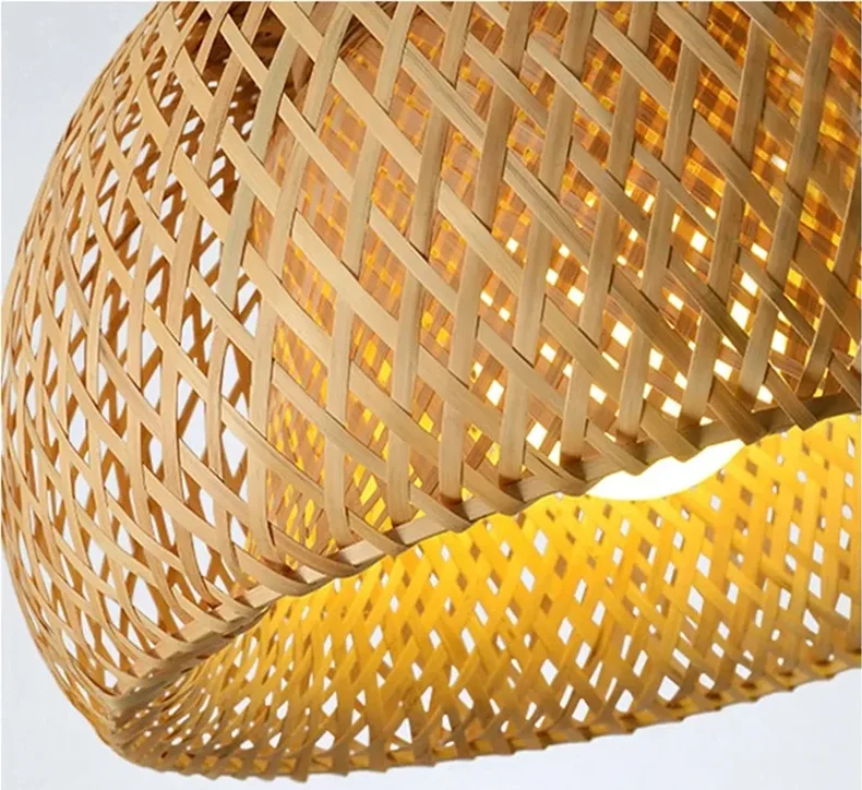 Close-up of the ZenWeave Bamboo Pendant Light, showcasing the intricate, hand-knitted texture of the natural bamboo material and the warm light it diffuses. VelunaLumin.