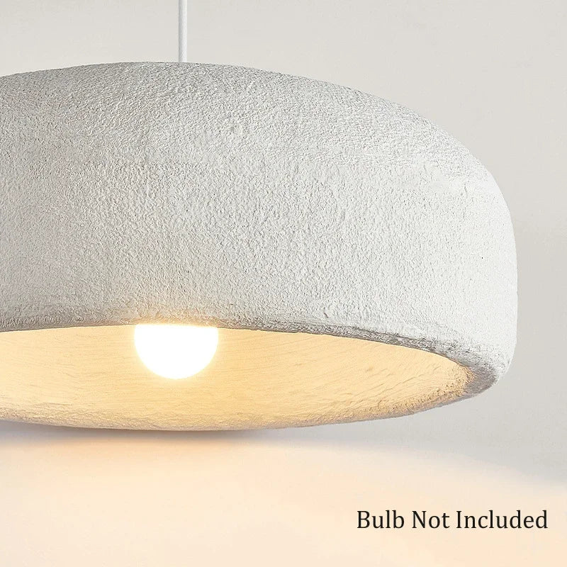 Close-up of ZenGlow Organic Pendant Light's white high-polymer shade, showcasing its fluid, paper-like texture and delicate sculptural form, VelunaLumin unique design.