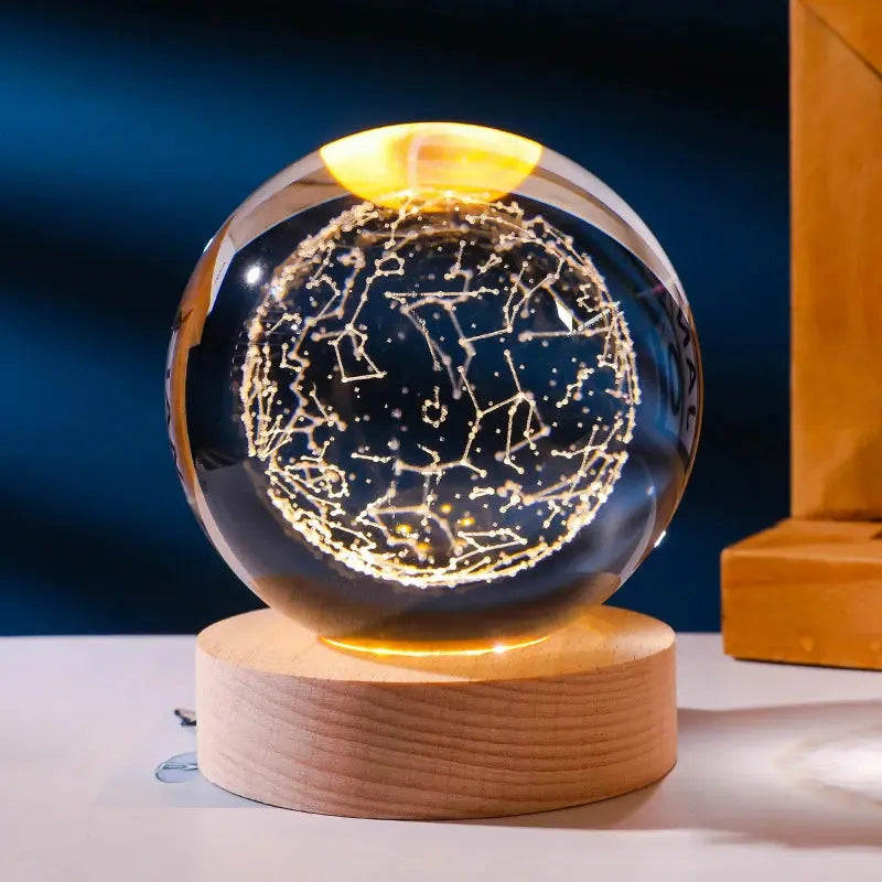 Cosmos 3D galaxy crystal sphere night light on wood base.