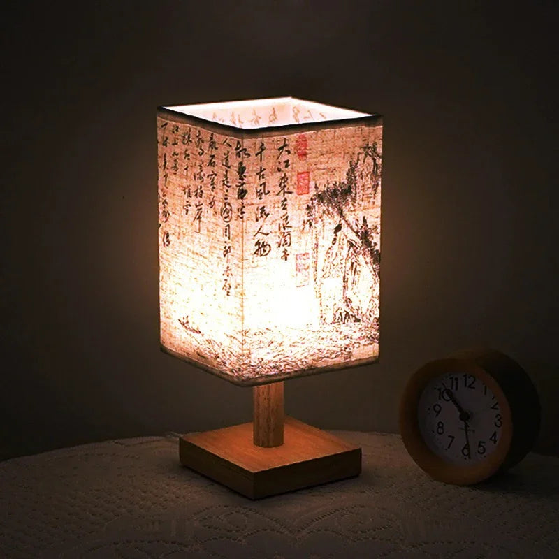 SereneScape Artisan Table Lamp with 'Sakura Bloom' oriental art linen shade, dimmable warm light, and solid wood base. VelunaLumin.