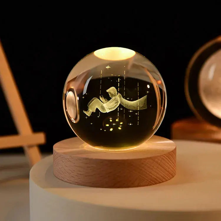 Cosmos 3D galaxy crystal sphere night light on wood base.