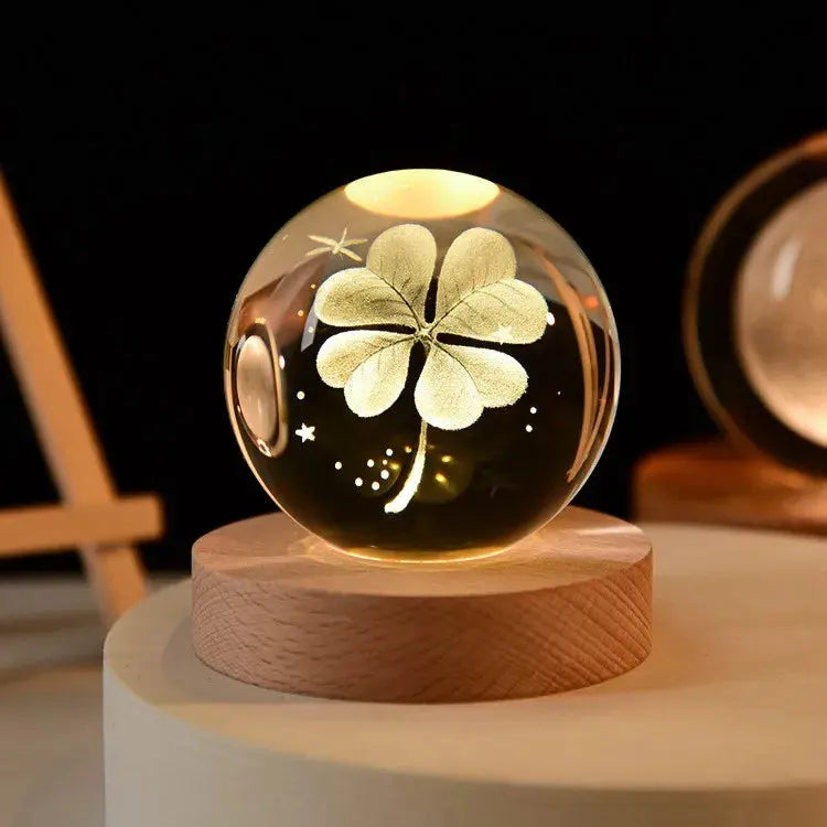 Cosmos 3D galaxy crystal sphere night light on wood base.