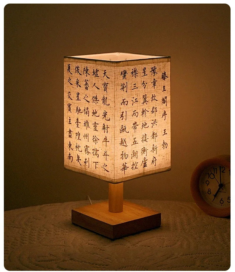 Close-up of the SereneScape Artisan Table Lamp's solid wood base and oriental art linen shade, showcasing its handcrafted quality. VelunaLumin.