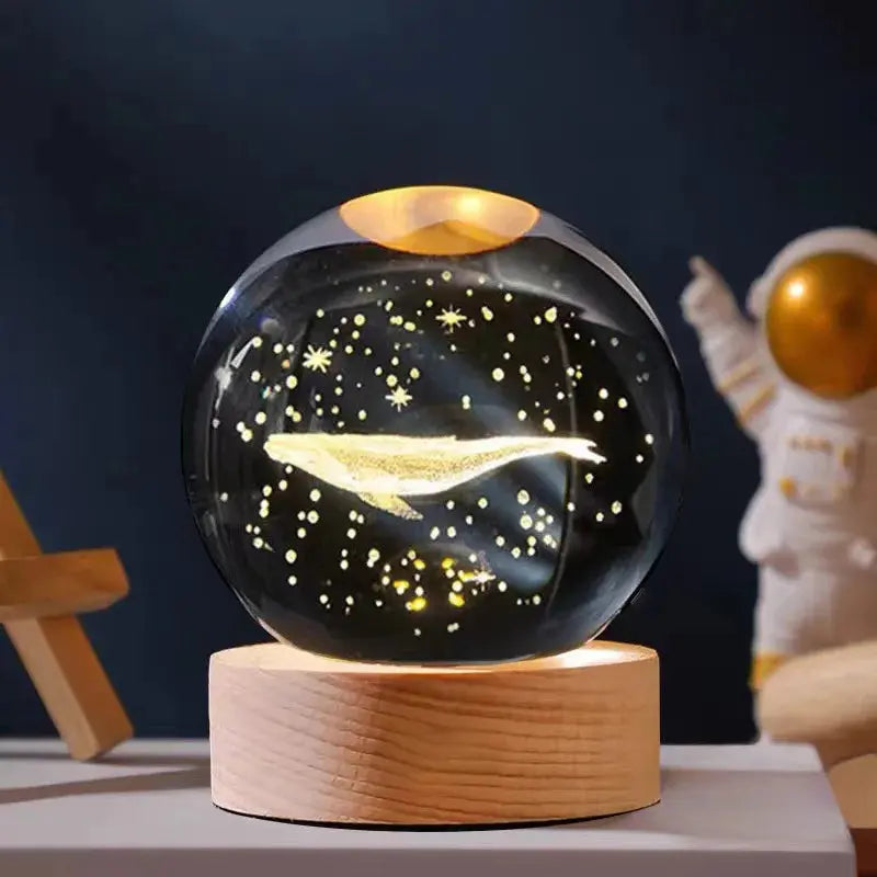 Cosmos 3D galaxy crystal sphere night light on wood base.