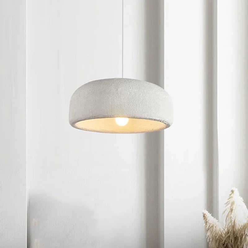 ZenGlow Organic Pendant Light hanging elegantly over a minimalist dining table, casting a soft, diffused ambient light, creating a tranquil Japanese-inspired atmosphere, VelunaLumin.