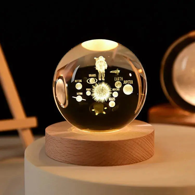 Cosmos 3D galaxy crystal sphere night light on wood base.