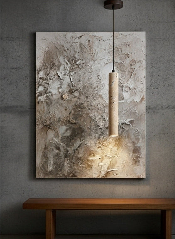 TerraGlow Natural Stone Pendant Light illuminating a textured abstract artwork, highlighting both the lamp's unique stone and the art's details in a minimalist gallery setting. VelunaLumin.