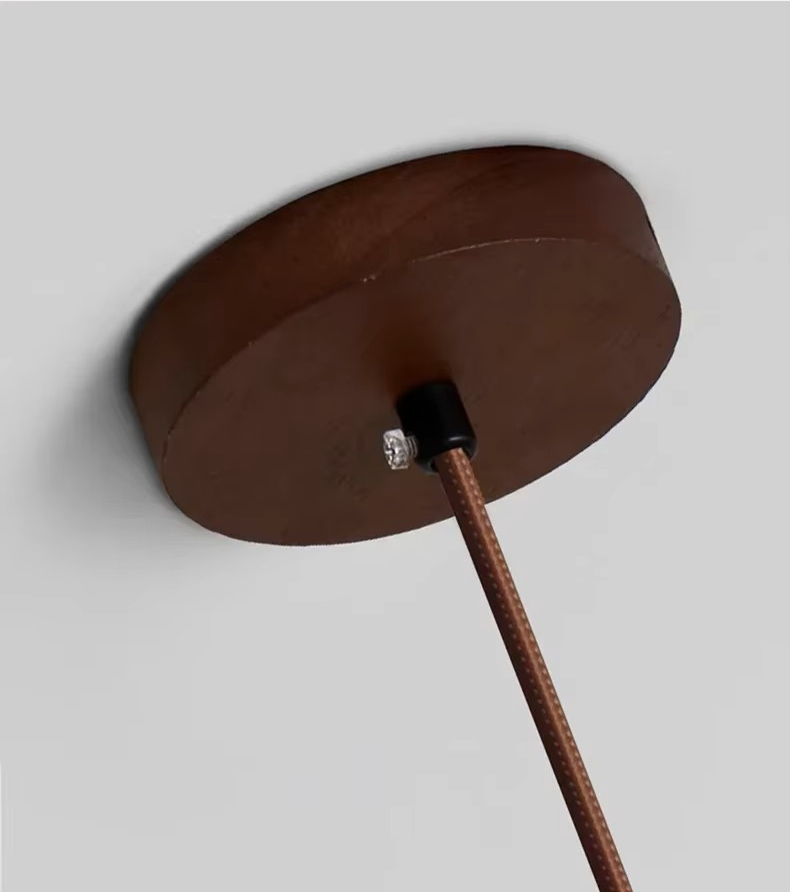 Detail of TerraGlow Natural Stone Pendant Light showing G9 LED bulb (included), adjustable 180cm cord, and quality mounting hardware for secure installation. VelunaLumin.