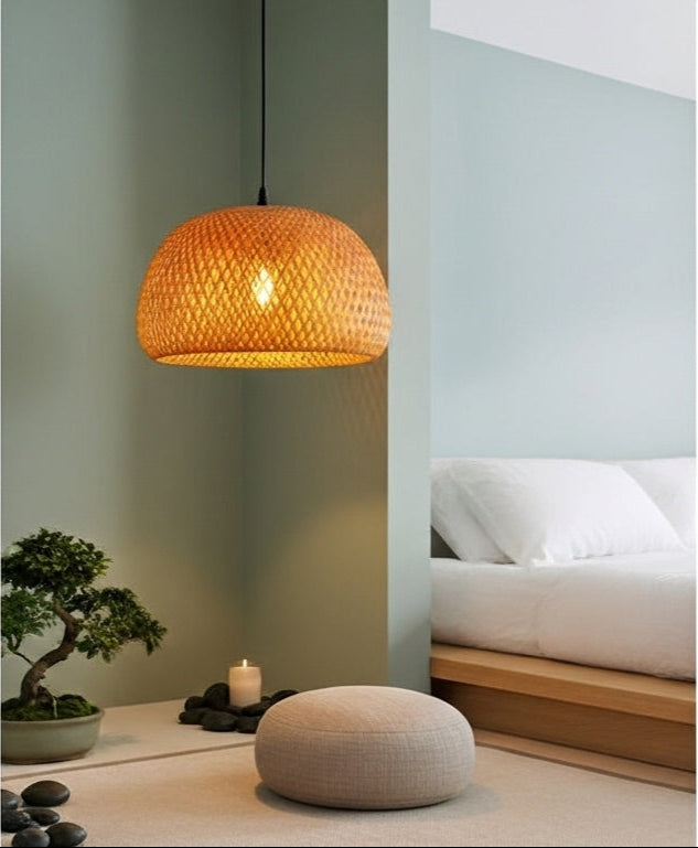 A ZenWeave bamboo pendant illuminating a calm meditation corner in a modern bedroom, with its layered design casting peaceful patterns of light. VelunaLumin.