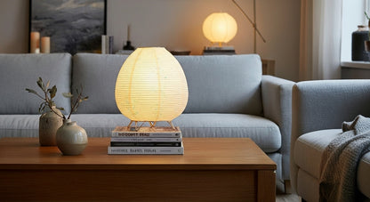 Akari Rice Paper Table Lamp as a decorative centerpiece on a living room side table, adding a touch of minimalist, organic artistry. VelunaLumin.