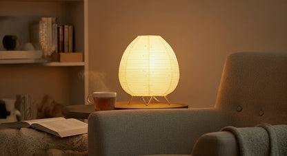 Akari Rice Paper Table Lamp as a decorative centerpiece on a living room side table, adding a touch of minimalist, organic artistry. VelunaLumin.