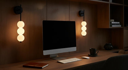 AuraBeam Linear Wall Sconce in Gold mounted beside a bed, providing a sophisticated and warm ambient glow in a contemporary bedroom. VelunaLumin.