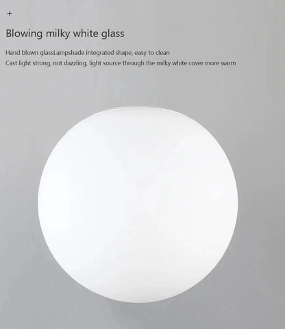 Close-up of the AuraOrb Ceiling Light showing the detail of the frosted glass globe and the premium metal base in a brushed gold finish. VelunaLumin.