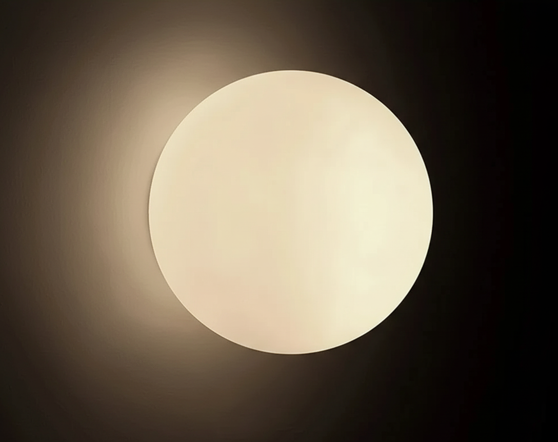 Close-up of the AuraOrb Ceiling Light showing the detail of the frosted glass globe and the premium metal base in a brushed gold finish. VelunaLumin.