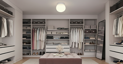 AuraOrb Minimalist ceiling light with a black finish centrally mounted in a modern, organized walk-in closet, offering clear and uniform boutique-style illumination. VelunaLumin.