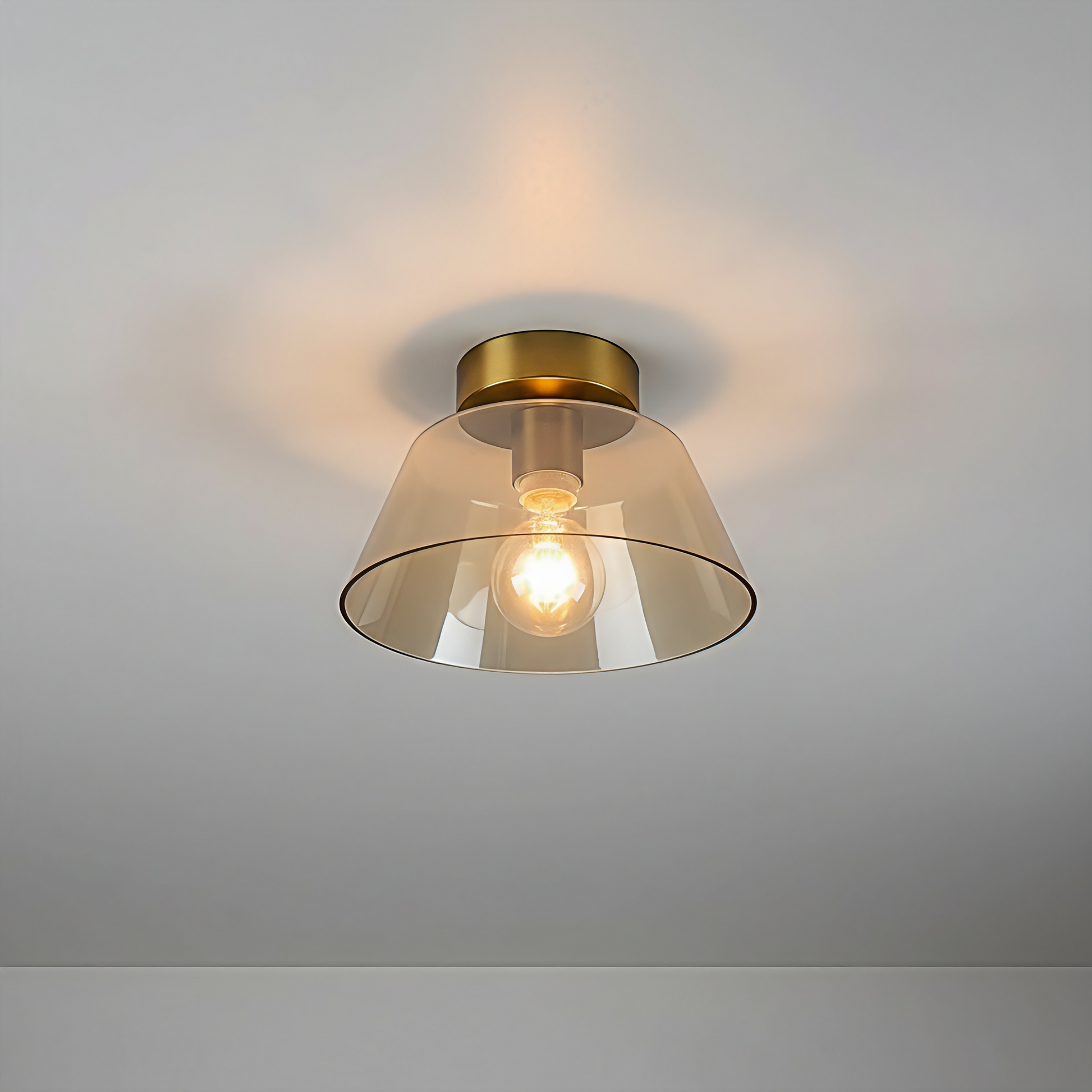 AuraSphere Glass Ceiling Light in a warm Amber glass finish, featuring a modern gold base, surface mounted. VelunaLumin.