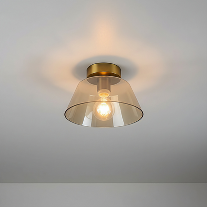 AuraSphere Glass Ceiling Light in a warm Amber glass finish, featuring a modern gold base, surface mounted. VelunaLumin.