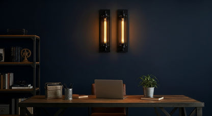 IronGlow Industrial Wall Sconce mounted above a dark-wood desk in a minimalist study, providing focused, characterful lighting for work or inspiration. VelunaLumin.