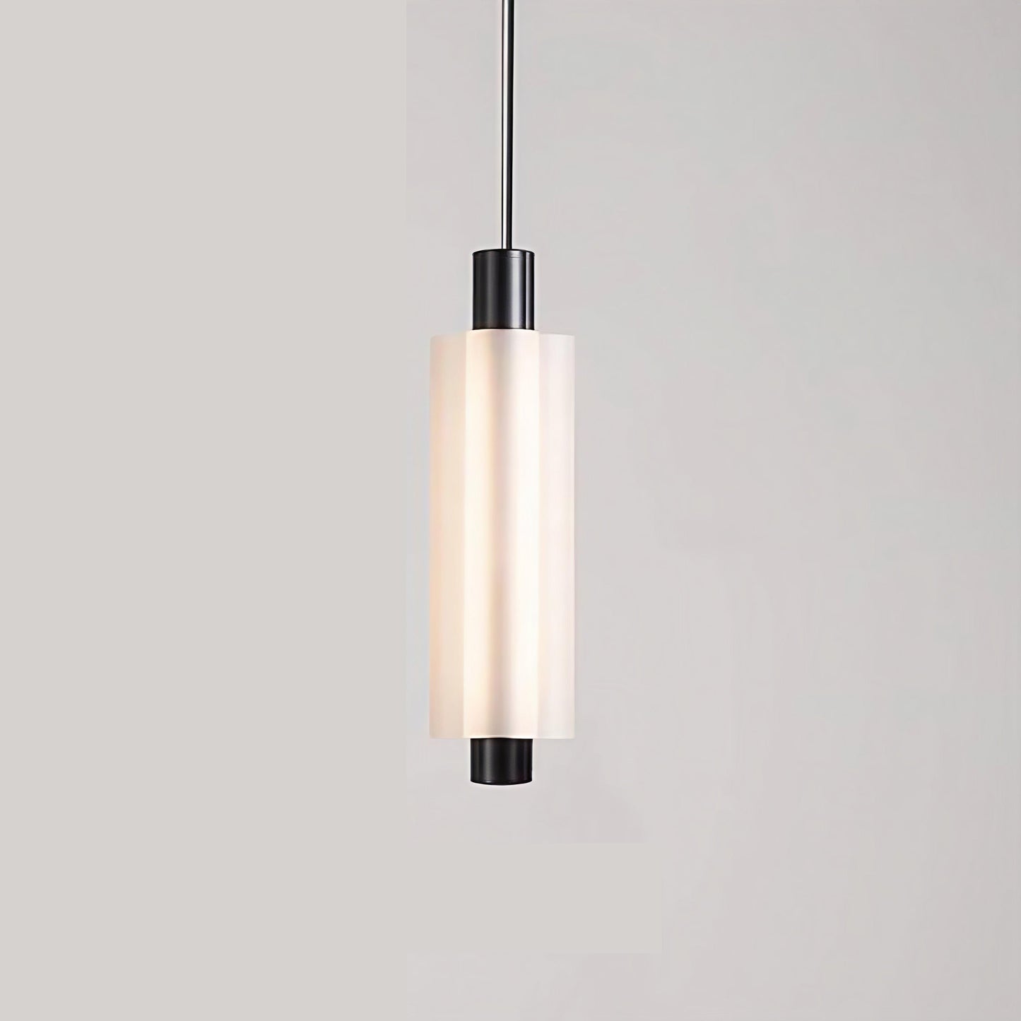 Linea modern long acrylic pendant light as bedside lighting.