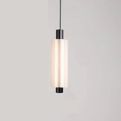Linea modern long acrylic pendant light as bedside lighting.