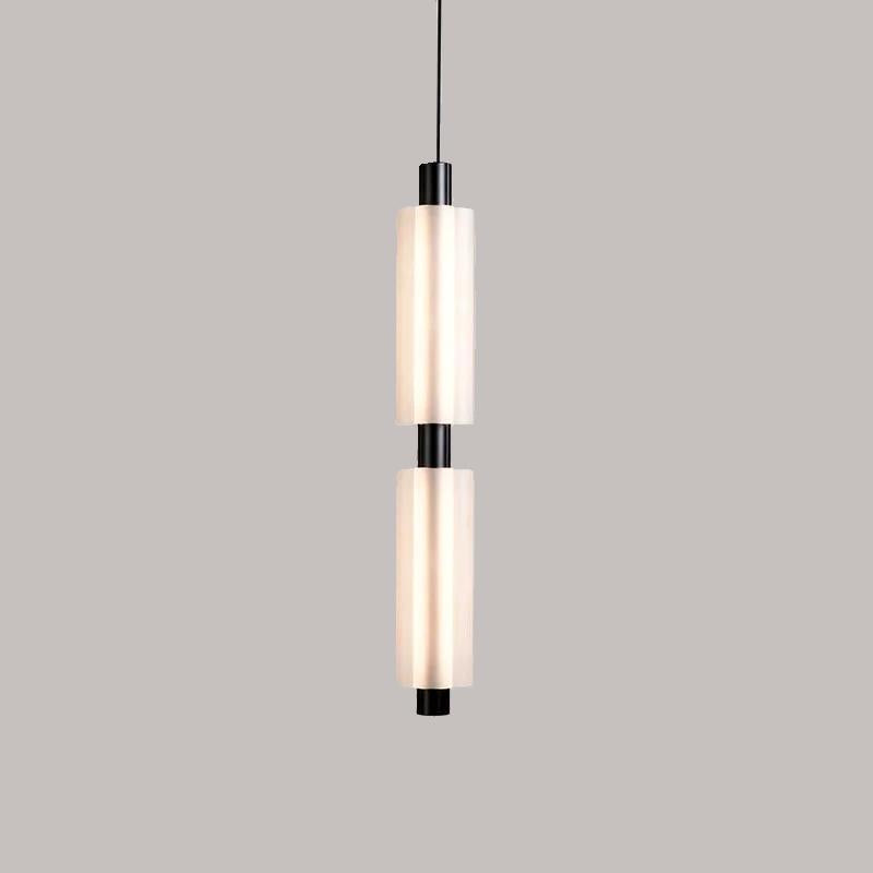 Linea modern long acrylic pendant light as bedside lighting.