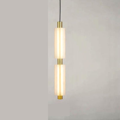 Linea modern long acrylic pendant light as bedside lighting.