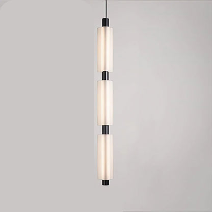 Linea modern long acrylic pendant light as bedside lighting.