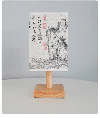 Close-up of the SereneScape Artisan Table Lamp's solid wood base and oriental art linen shade, showcasing its handcrafted quality. VelunaLumin.