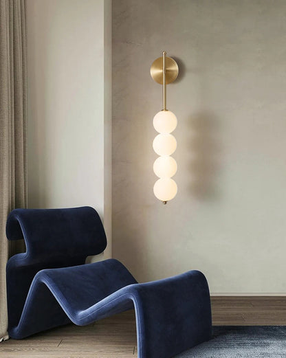 AuraBeam Linear Wall Sconce in Brushed Gold, a modern 'up & down' LED wall lamp with a perforated metal body. VelunaLumin.