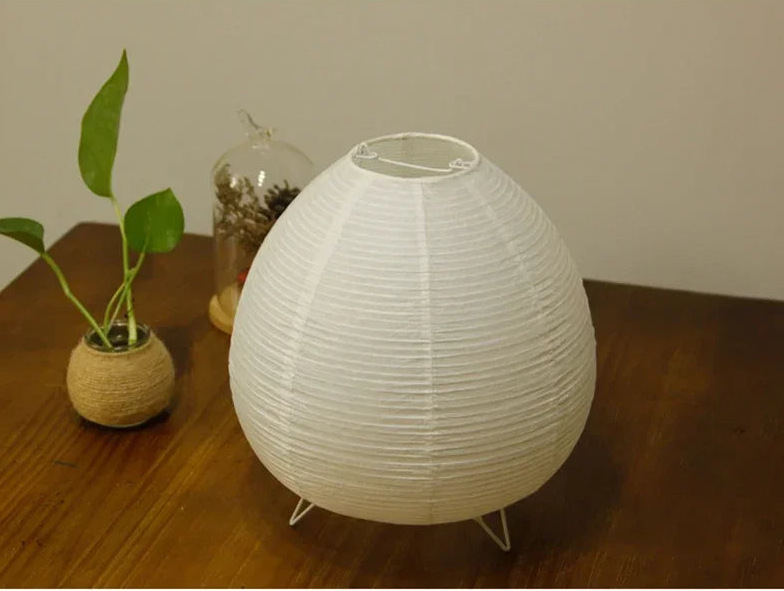 Close-up of the Akari Rice Paper Lamp, showcasing the delicate texture of the handcrafted rice paper shade and its unique, sculptural form. VelunaLumin.