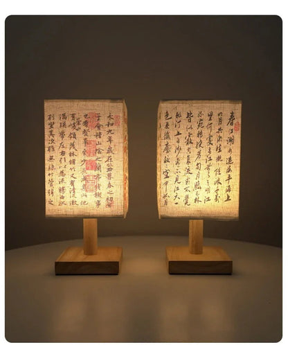 Close-up of the SereneScape Artisan Table Lamp's solid wood base and oriental art linen shade, showcasing its handcrafted quality. VelunaLumin.